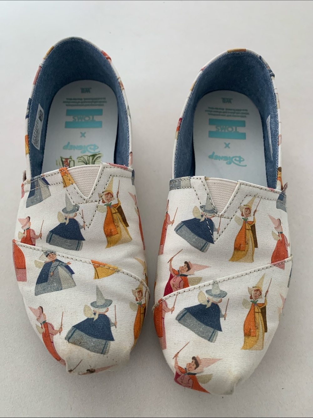 Tom’s Disney addition slip-ons